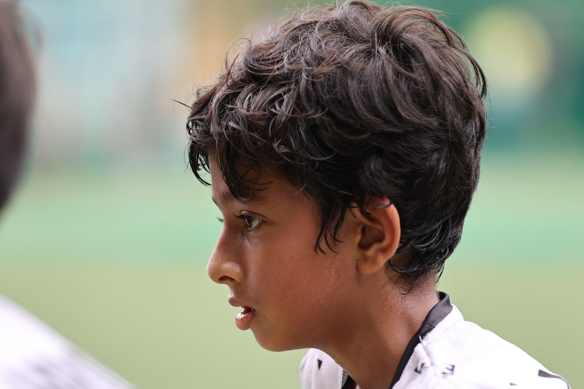 A player in profile, focused on the game