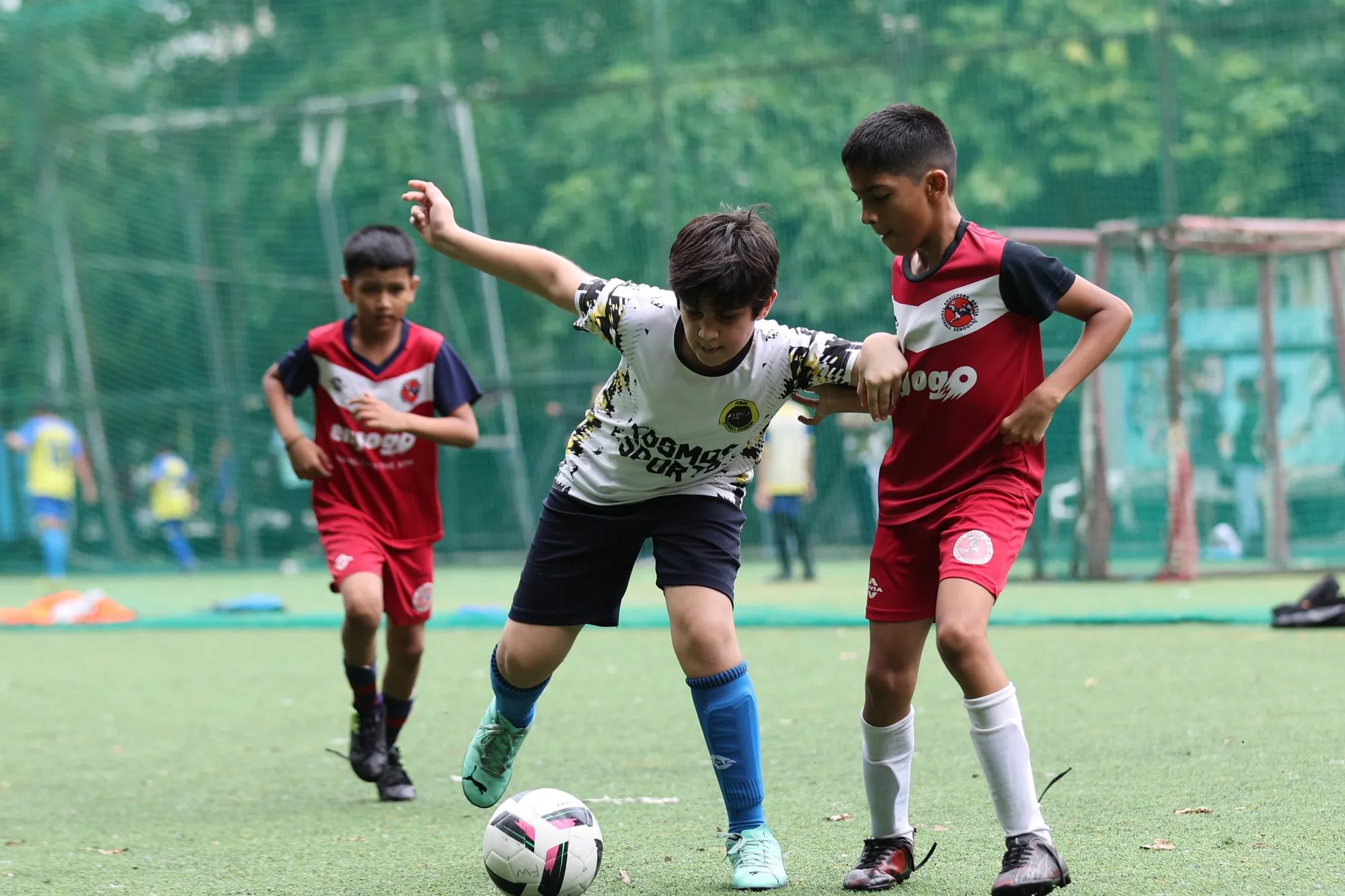 Two players chasing the ball during a small-sided match