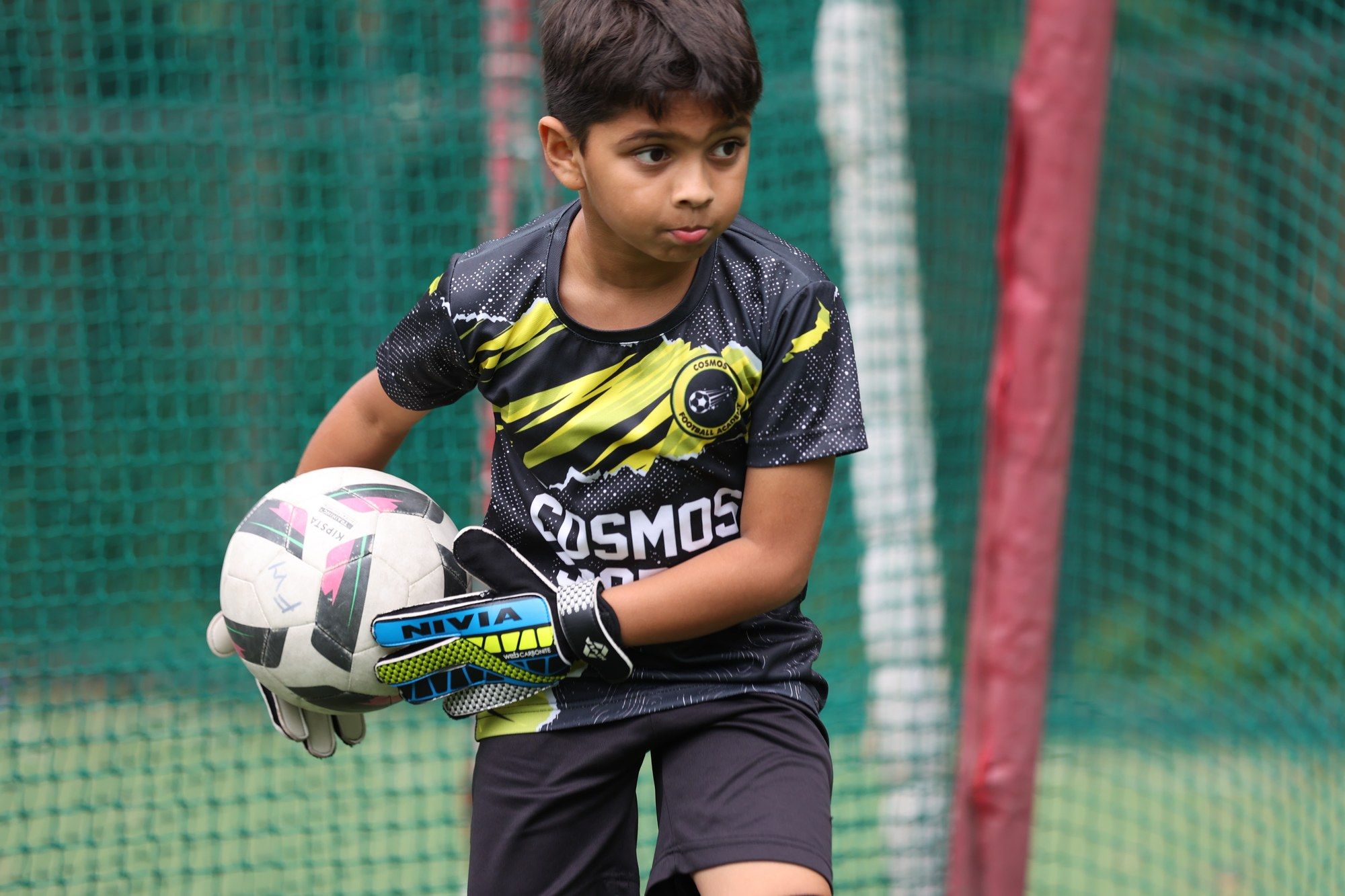 A goalkeeper holding the ball