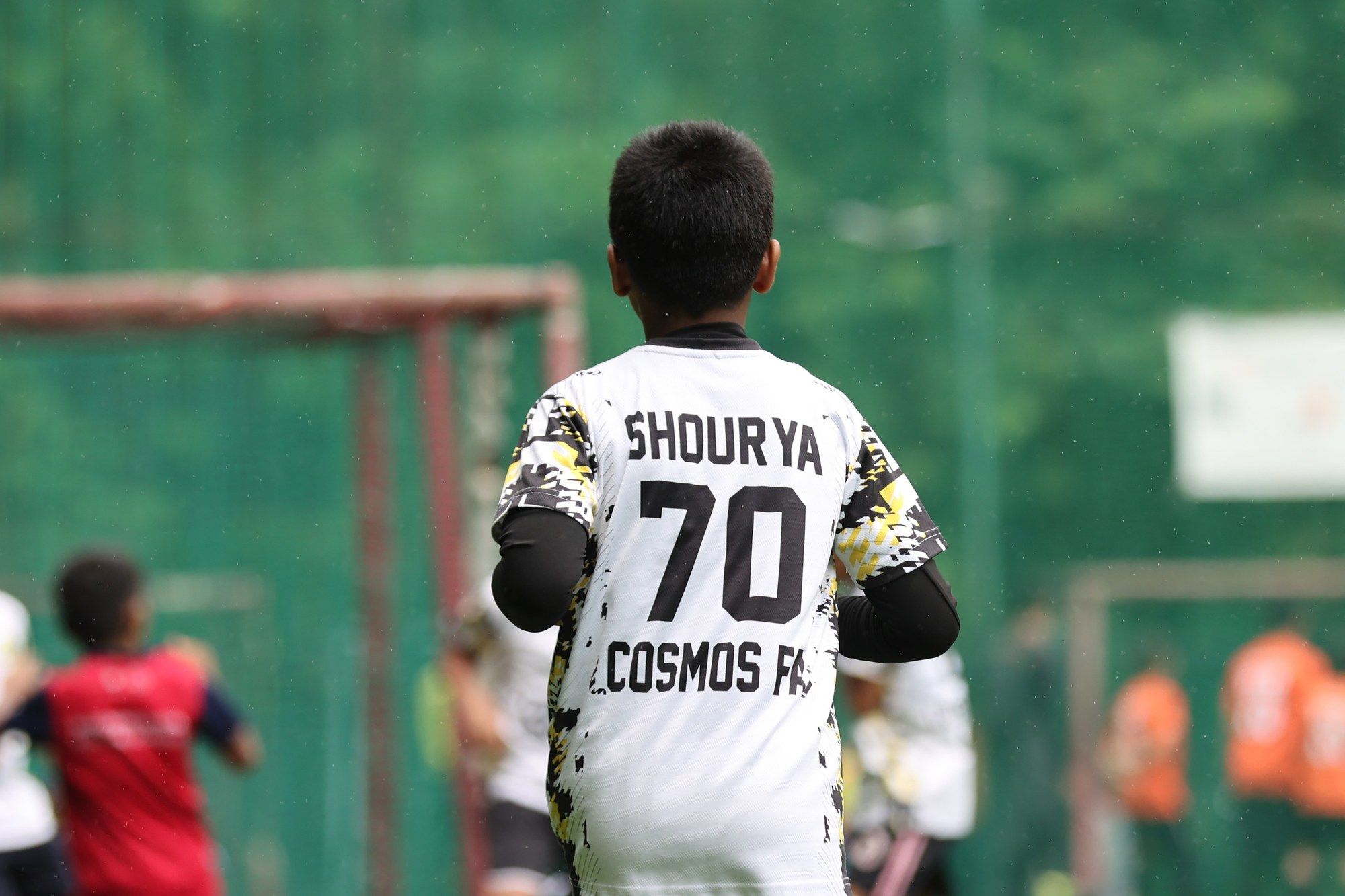 A player with number 70 on his back, seen from behind
