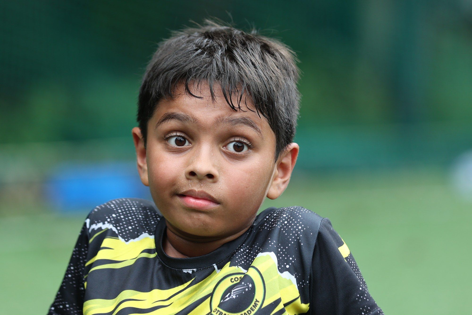 A surprised young player looking at the camera