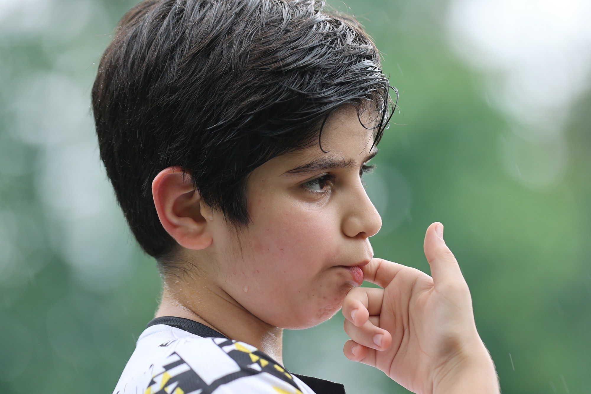 A player thinking, finger on his lips