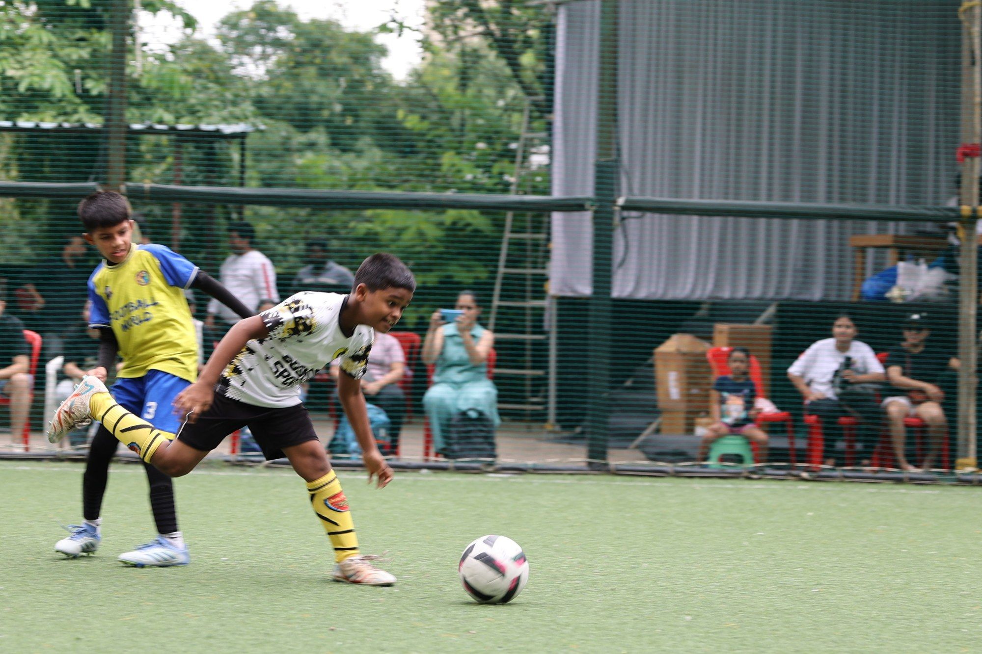 A tackle in front of a watching crowd