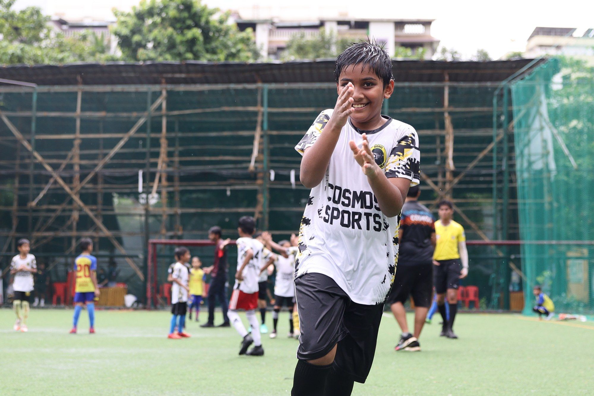 A young Cosmos player laughing