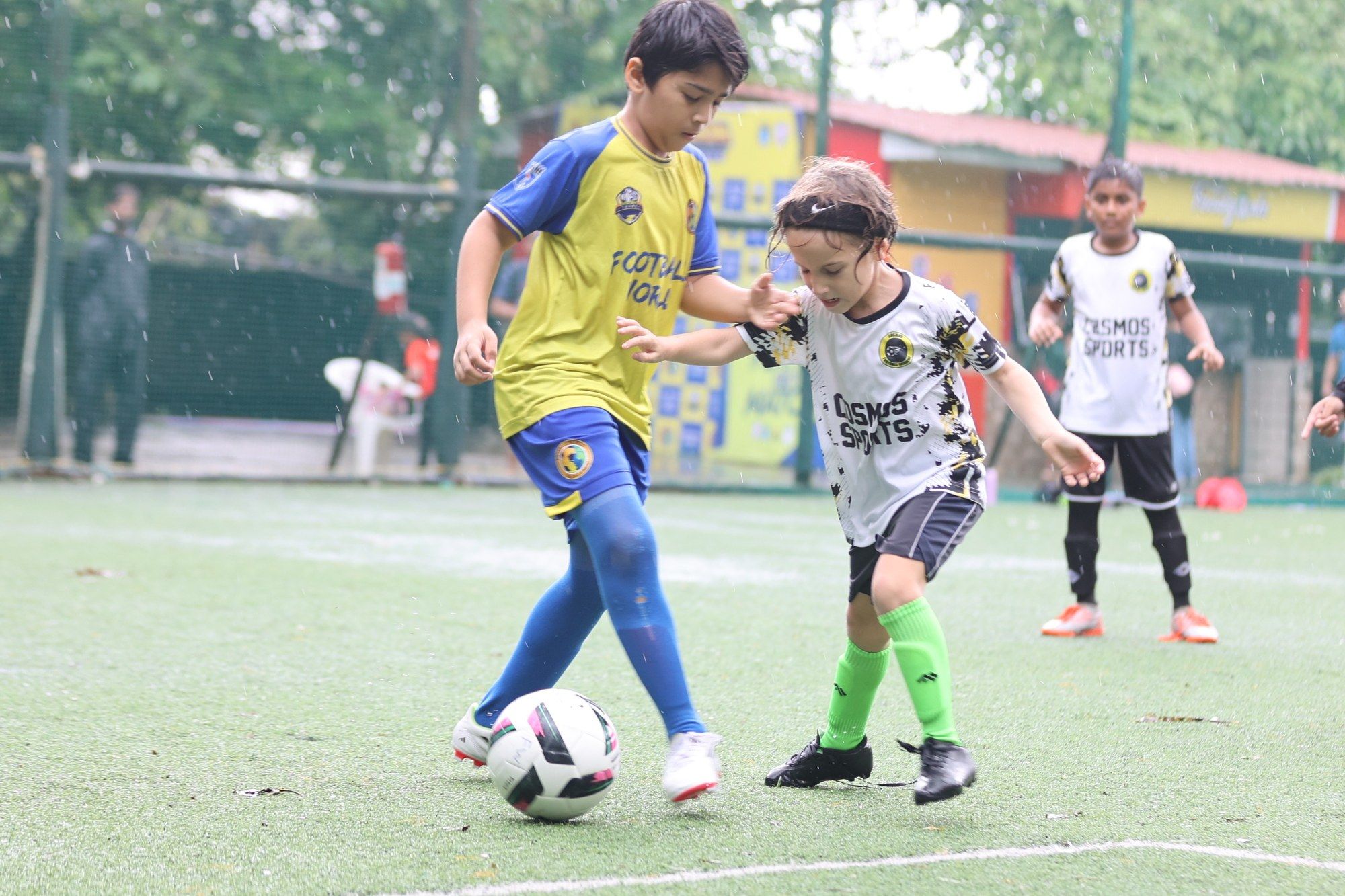 A Cosmos player shielding the ball from a defender