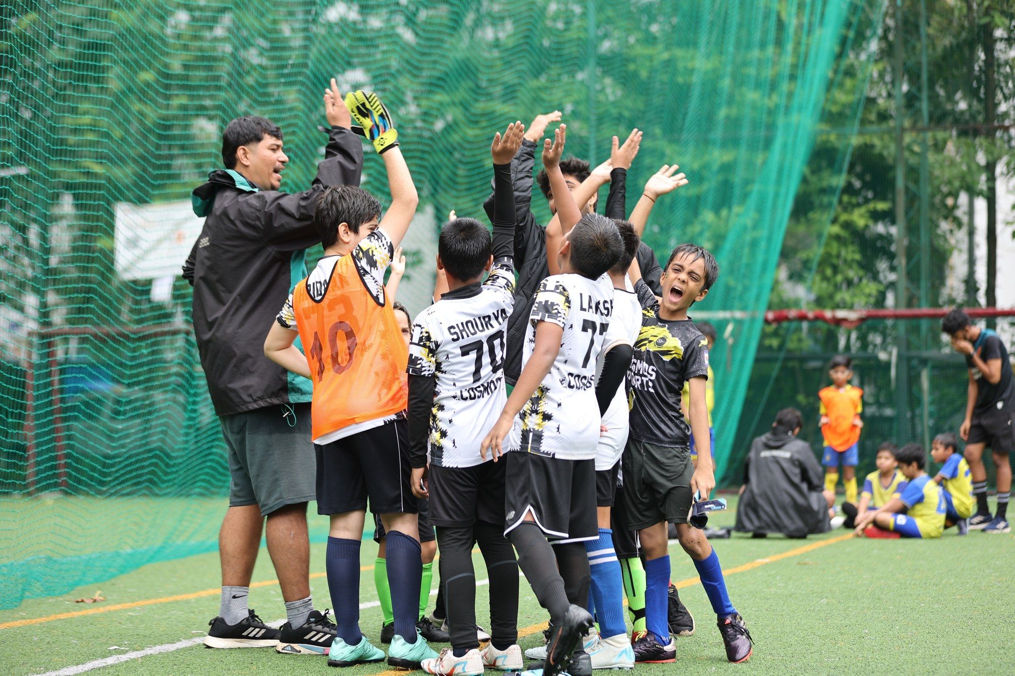 Players and coaches celebrating together