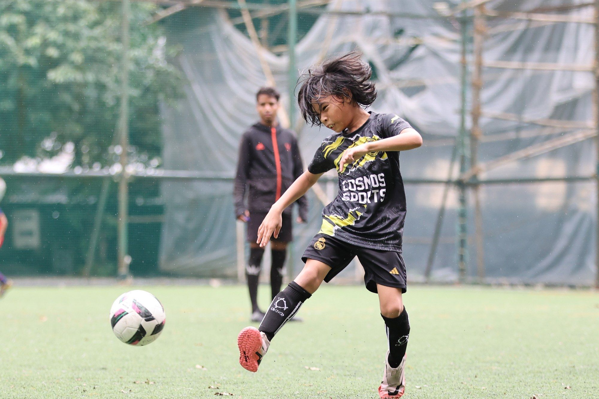 A player kicking the ball