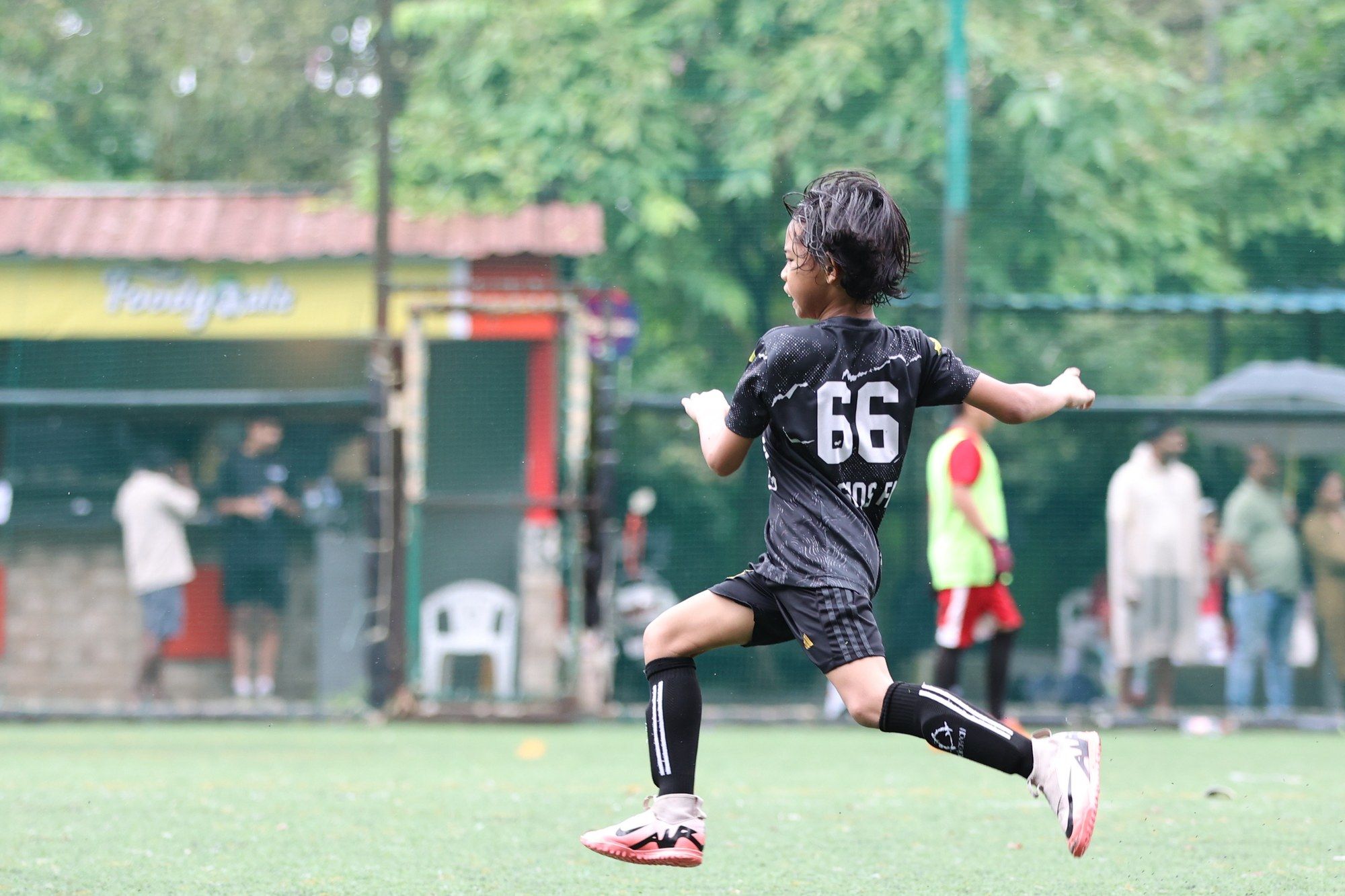 A player with number 66 sprinting