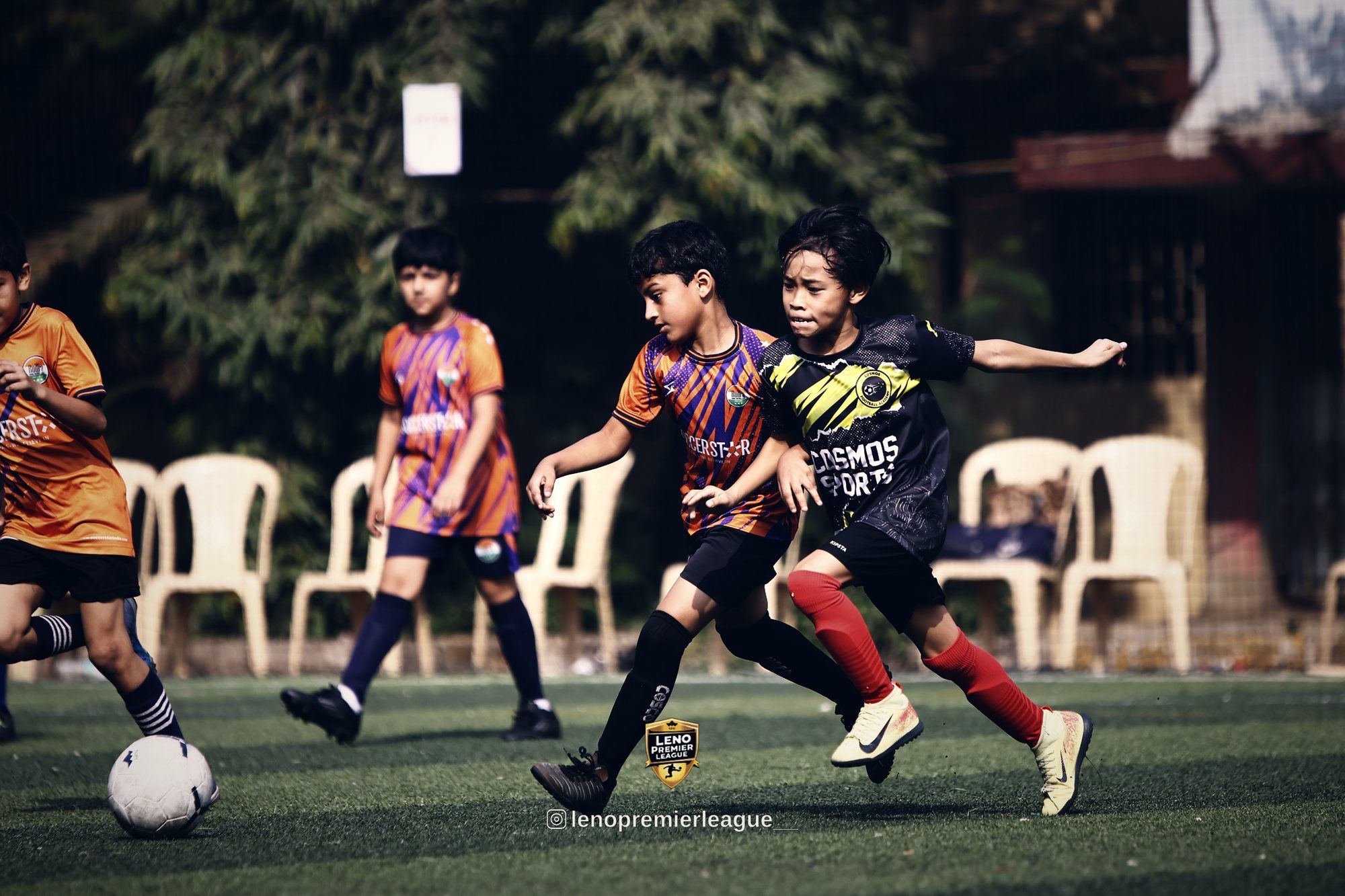Youth players competing for the ball